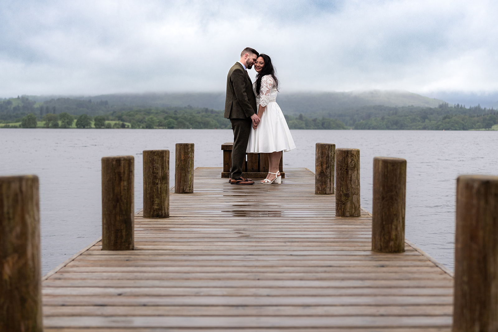 Wedding couple photographed next to Lake Windermere
